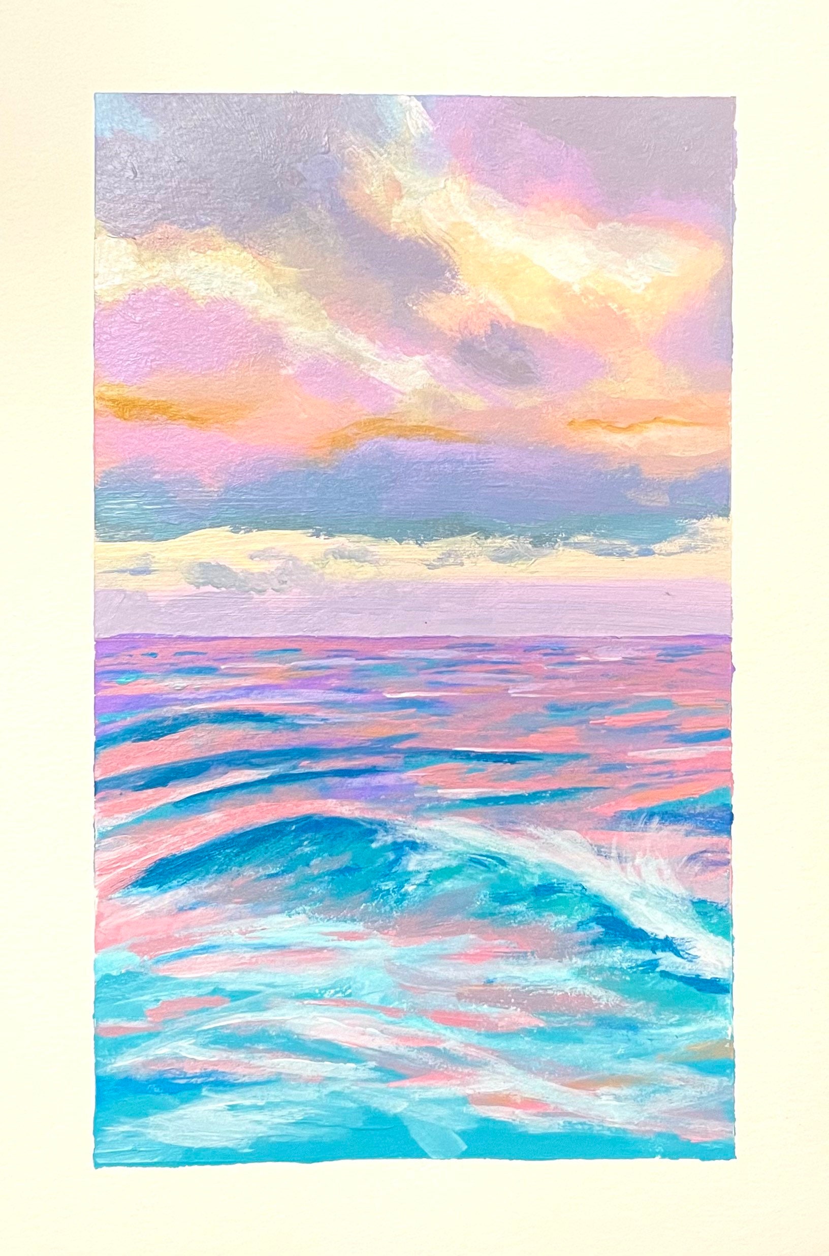 A soft ocean sunset in pink, purple and blue, where sky and water meet in gentle bands of color.