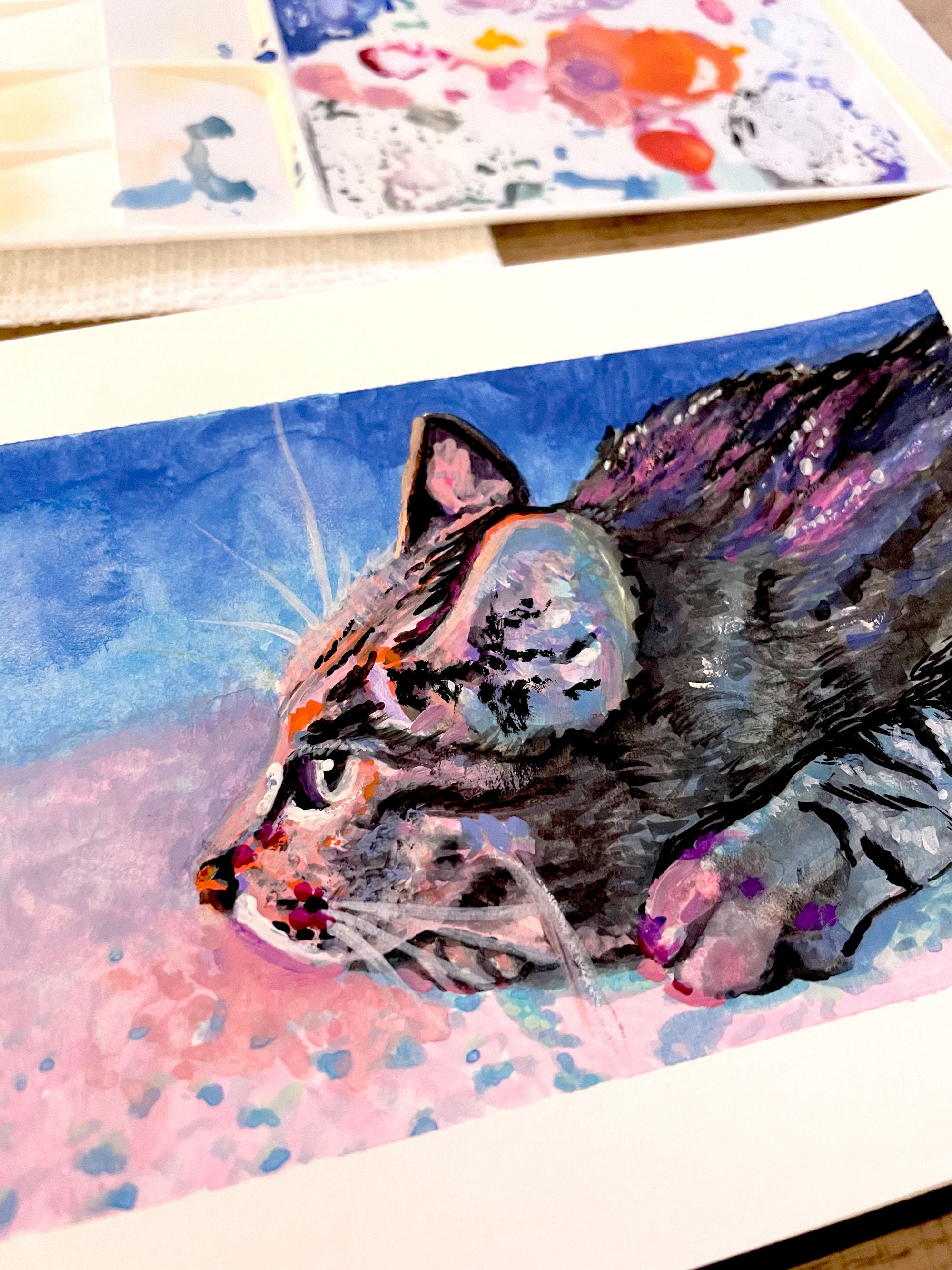 Painting detail: A striped tabby in pink, purple and blue.