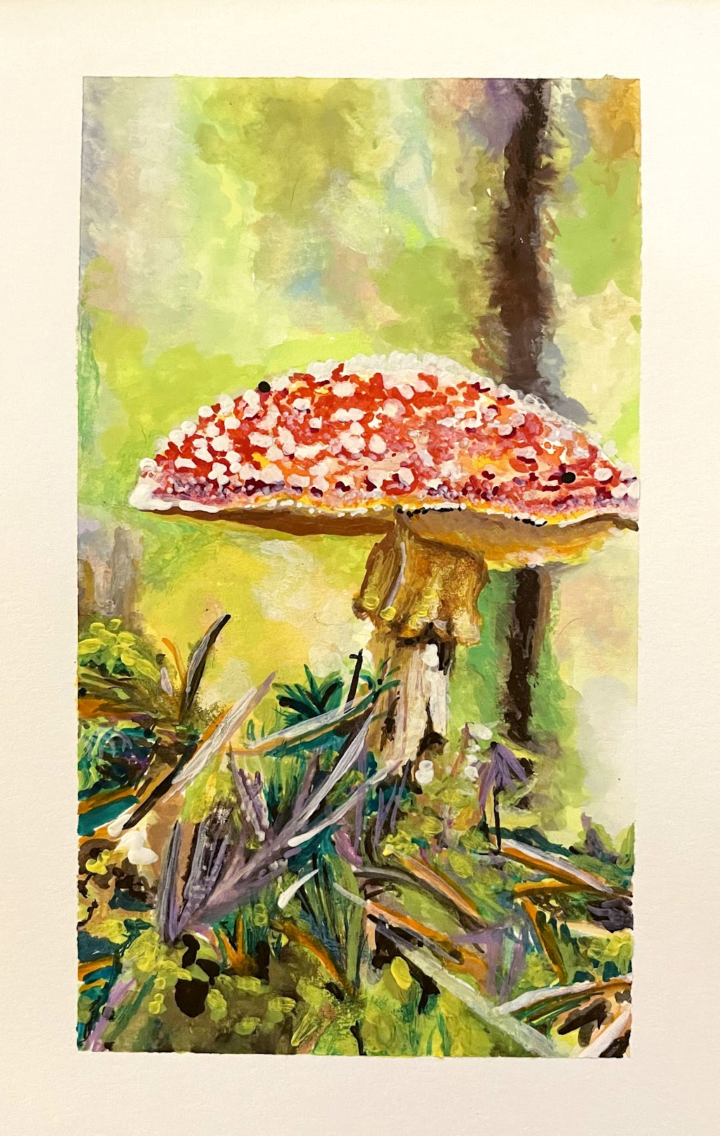 A red mushroom with white flecks, a pale stem and mossy forest floor against a soft green woodland background.
